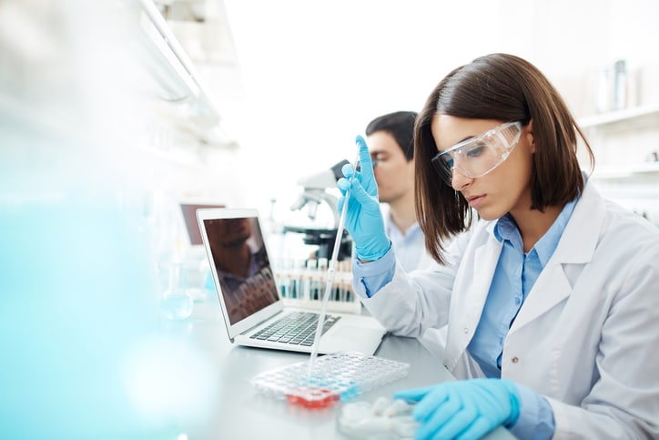 scientist using pipette laboratory