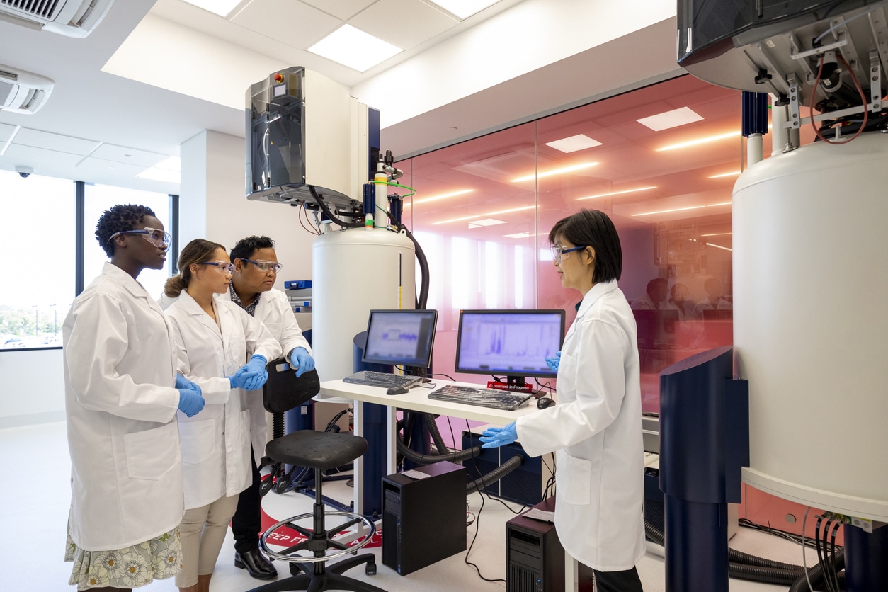 female scientist talking to her colleagues