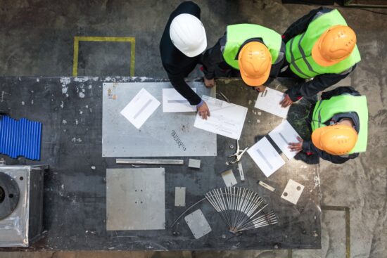 construction workers looking at plans