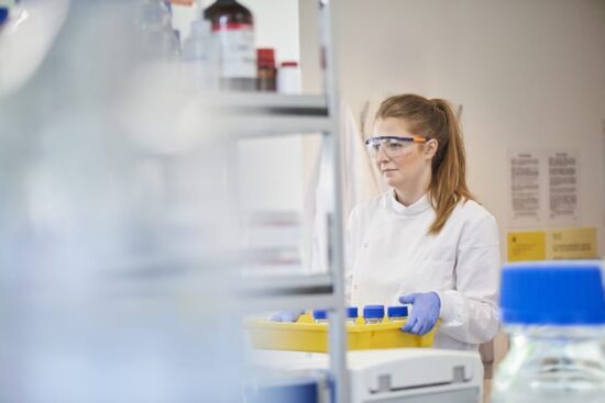 scientist carrying equipment