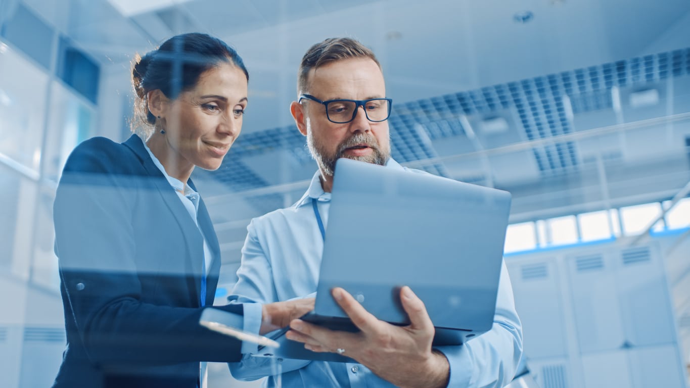 colleagues looking at laptop