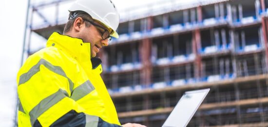 construction worker working on his laptop