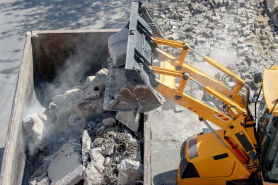 bulldozer dumping concrete