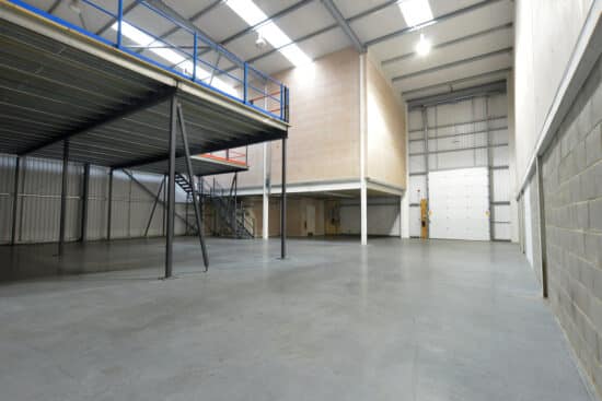 interior view of empty warehouse and mezzanine floor