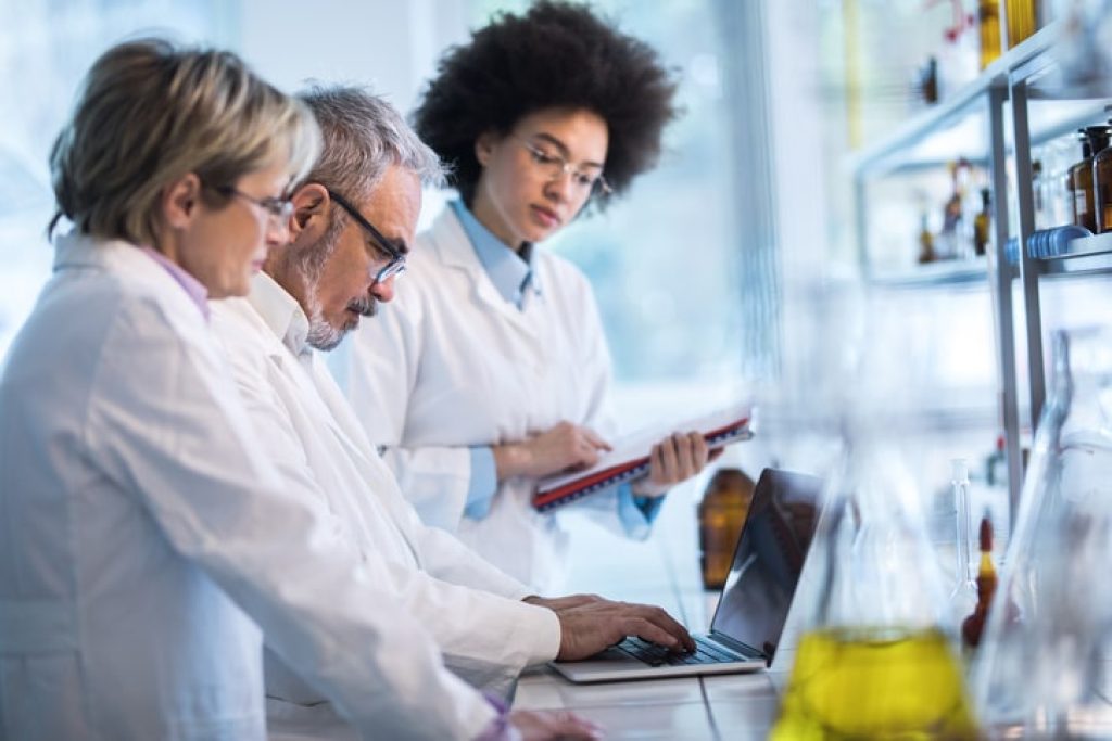 scientists in laboratory doing analysis